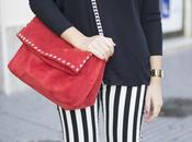 Striped pants touch red.